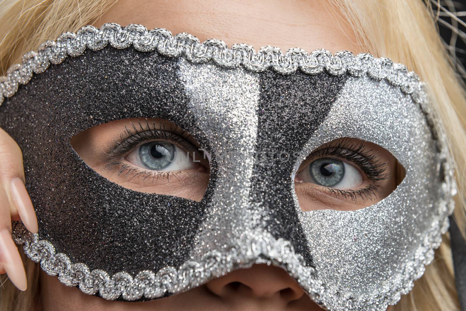 closeup of the eyes of a woman with carnival masquerade