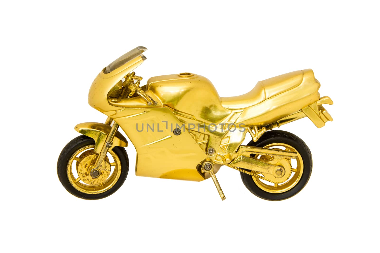 Motorcycle golden toy isolated on white by huntz