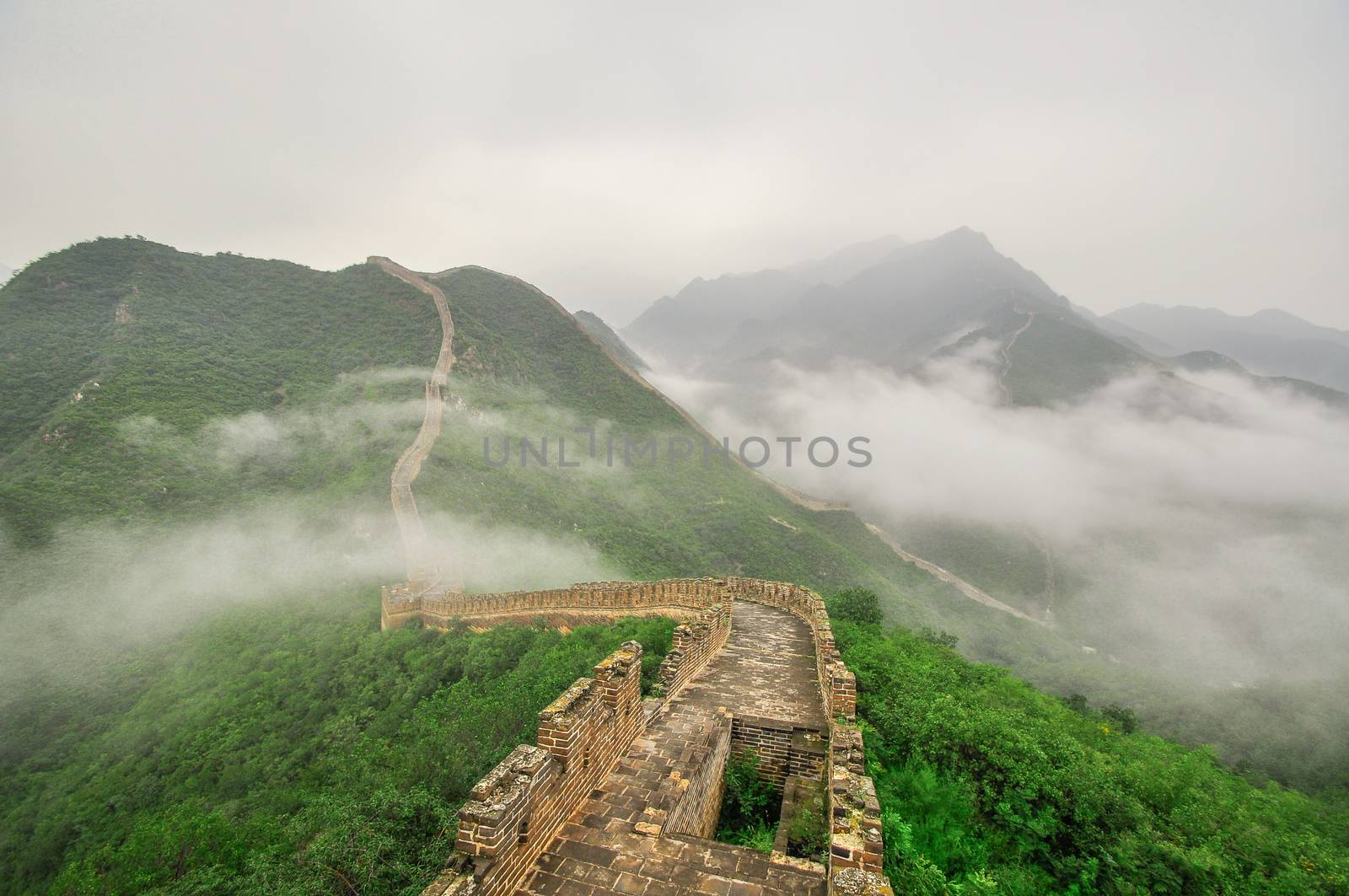 Great Wall fog over mountains in Beijing, China.