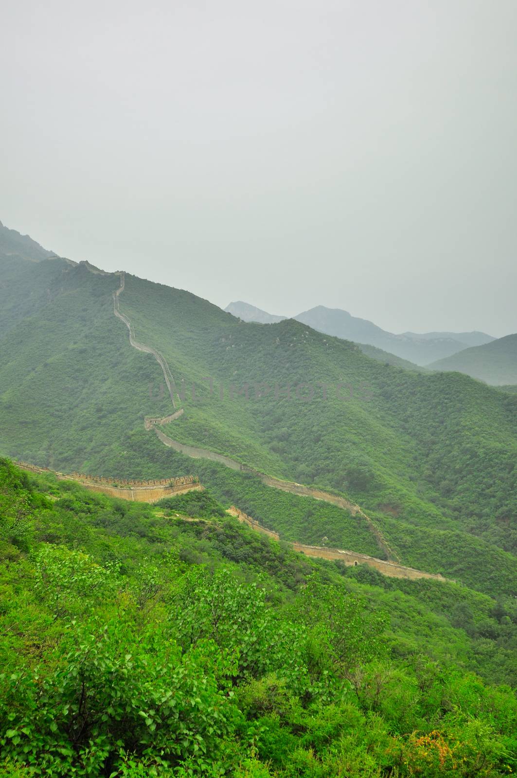 Great Wall fog over mountains in Beijing, China.