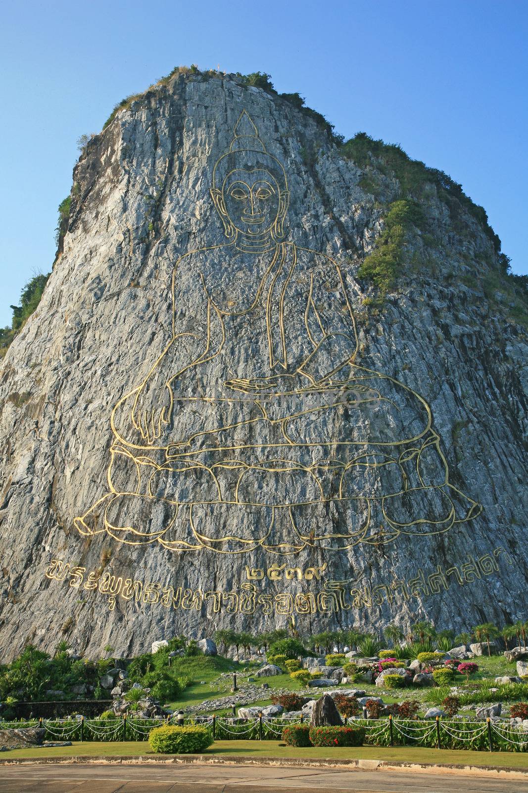 Carved buddha image on the cliff at Khao Chee Jan, Pattaya, Thailand