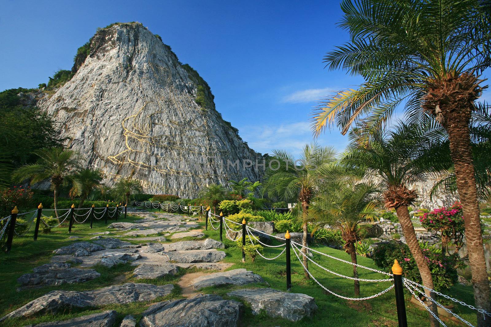 Carved buddha image on the cliff at Khao Chee Jan, Pattaya, Thai by think4photop