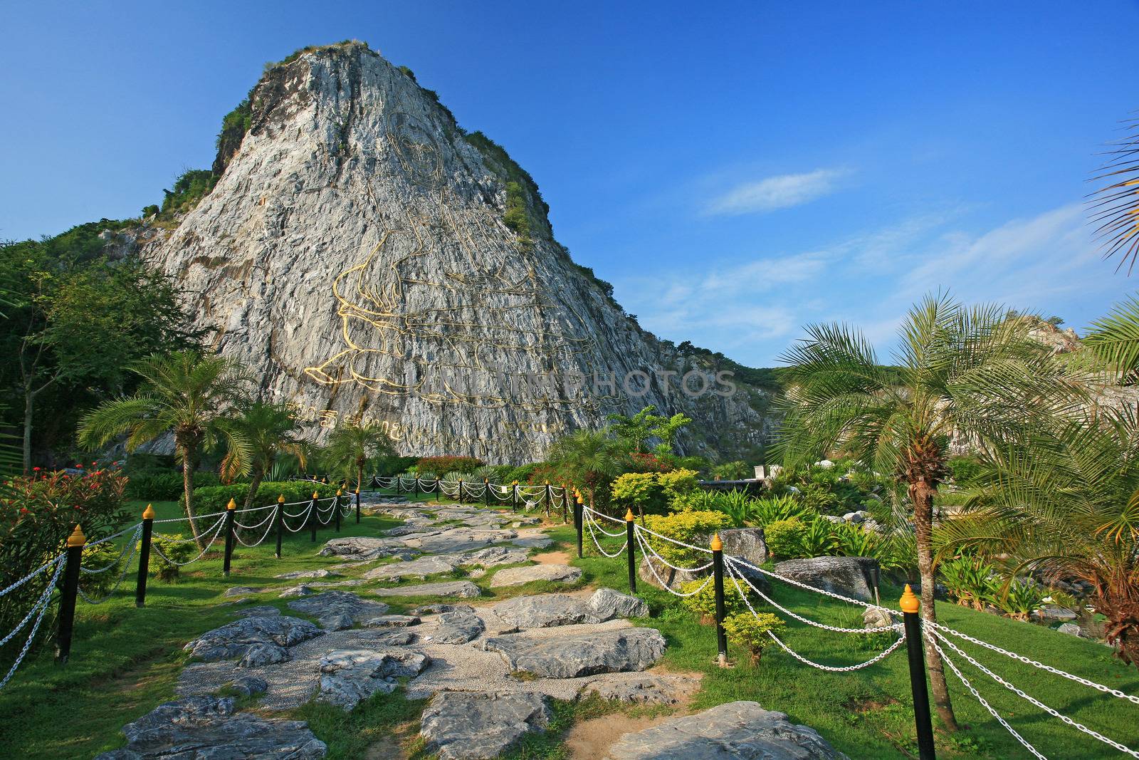 Carved buddha image on the cliff at Khao Chee Jan, Pattaya, Thai by think4photop