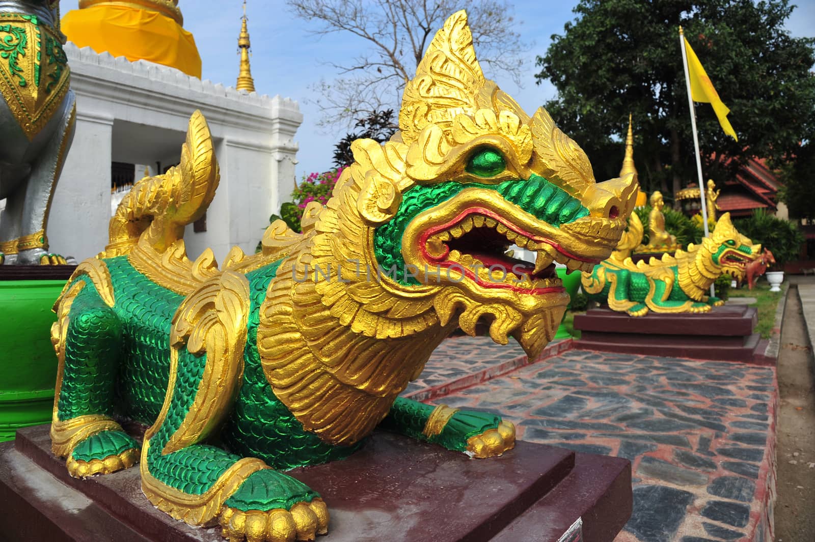 Singha statue in temple, Thailand by think4photop