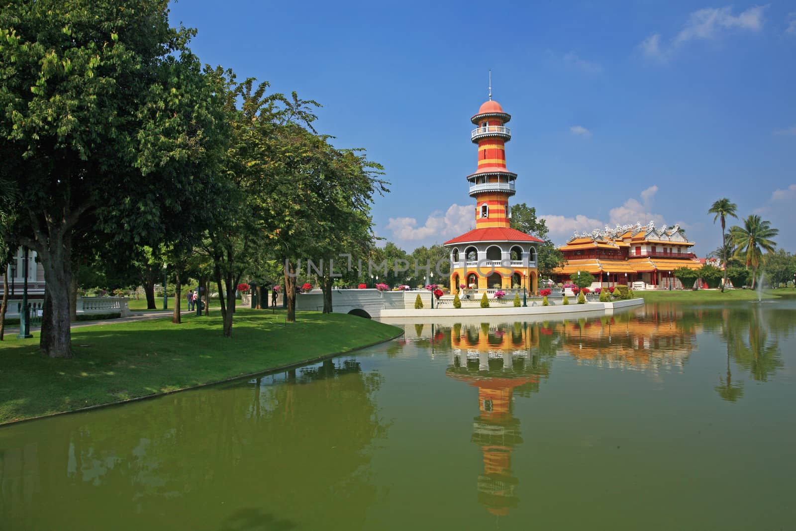 The tall tower in Bang Pa-In Palace, Ayutthaya, Thailand. by think4photop