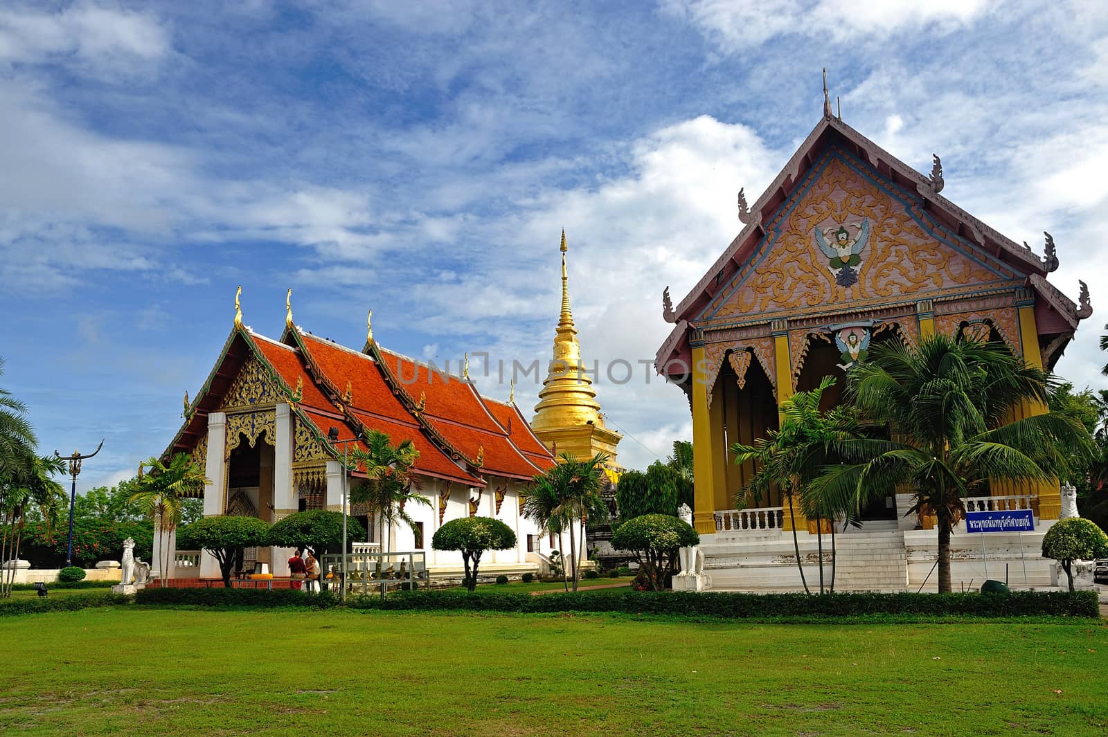 Golden Pagoda and blue sky, Wat Phra Thad Chang Kham, Nan Thaila by think4photop