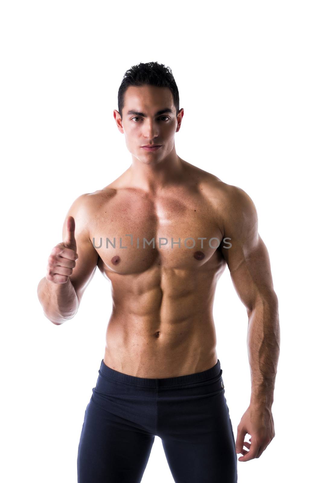 Shirtless muscular and attractive young man with thumb up doing OK sign