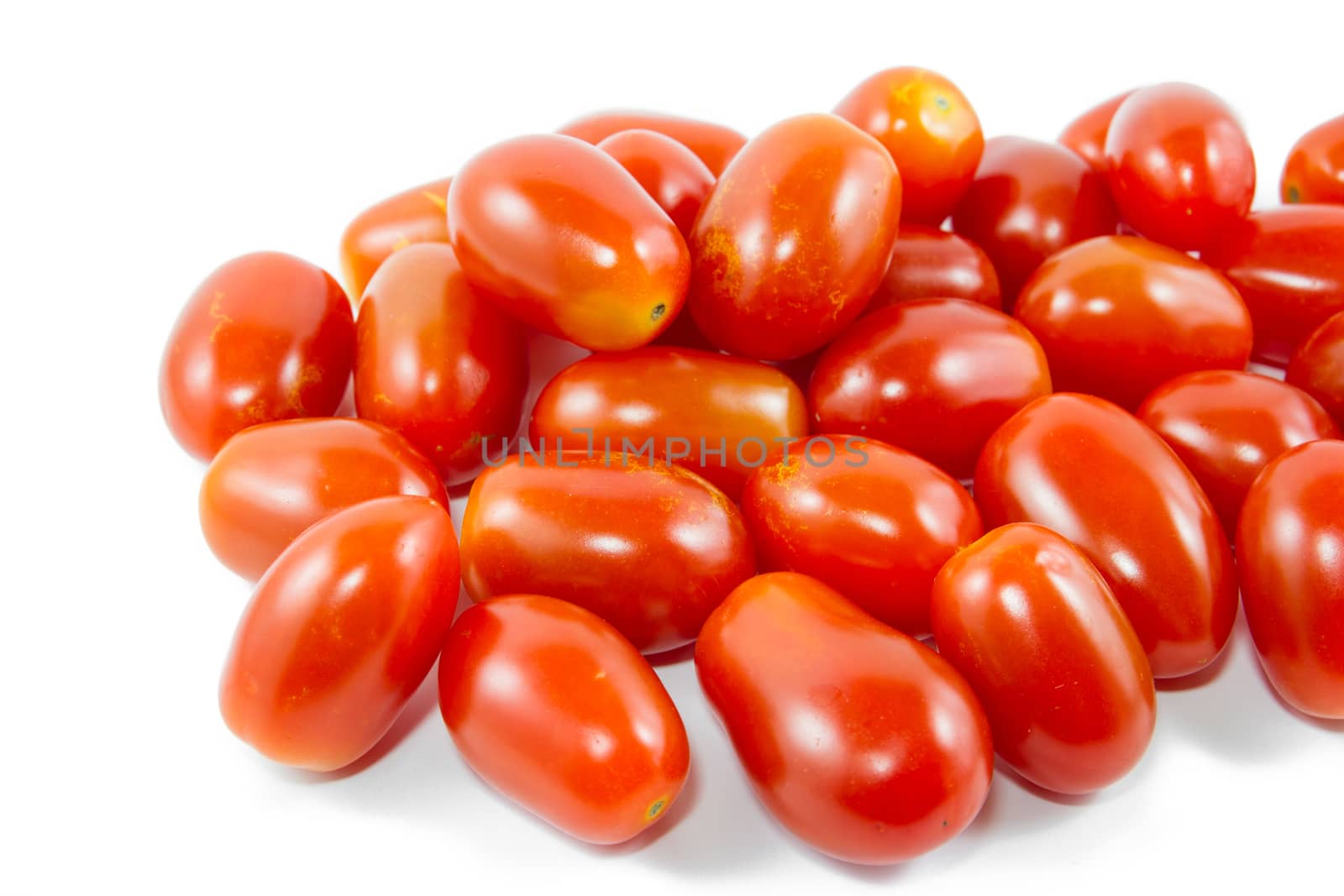 Group of cherry tomatoes isolated on white background