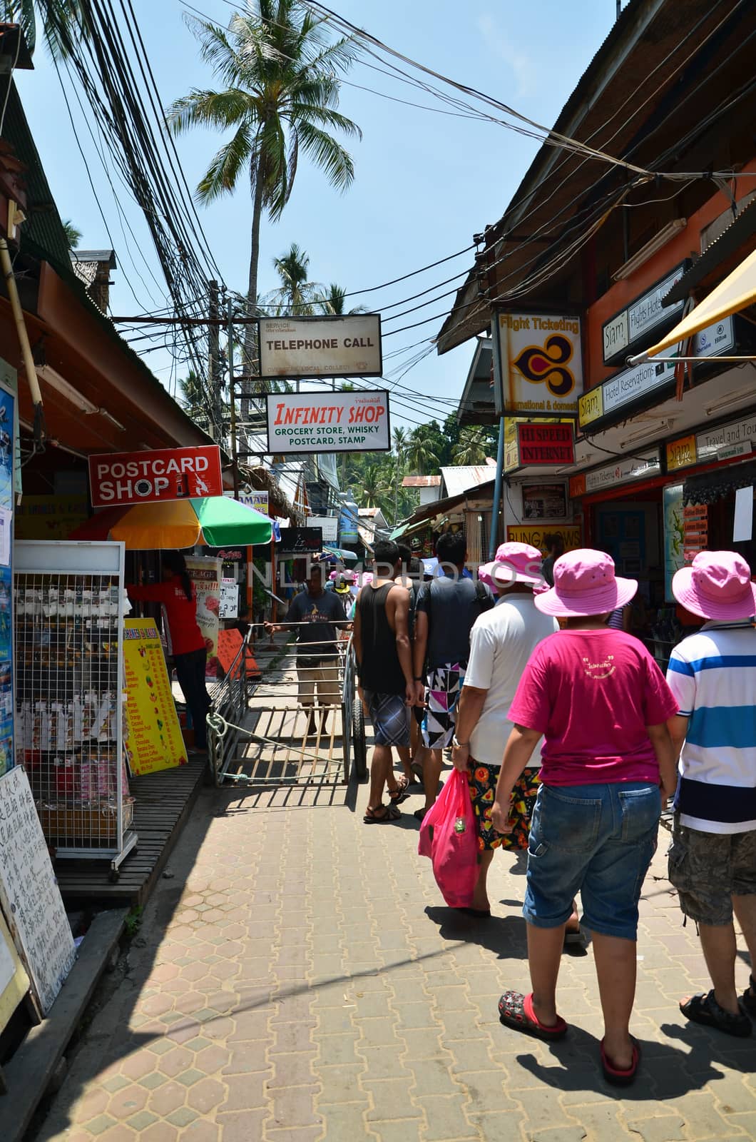 KRABI,THAILAND - APRIL 14, 2014 : The tourist visit small touristic village at Phi Phi island, Krabi,Thailand on april 14, 2014,  The village was completely destroyed from tsunami in 2004.