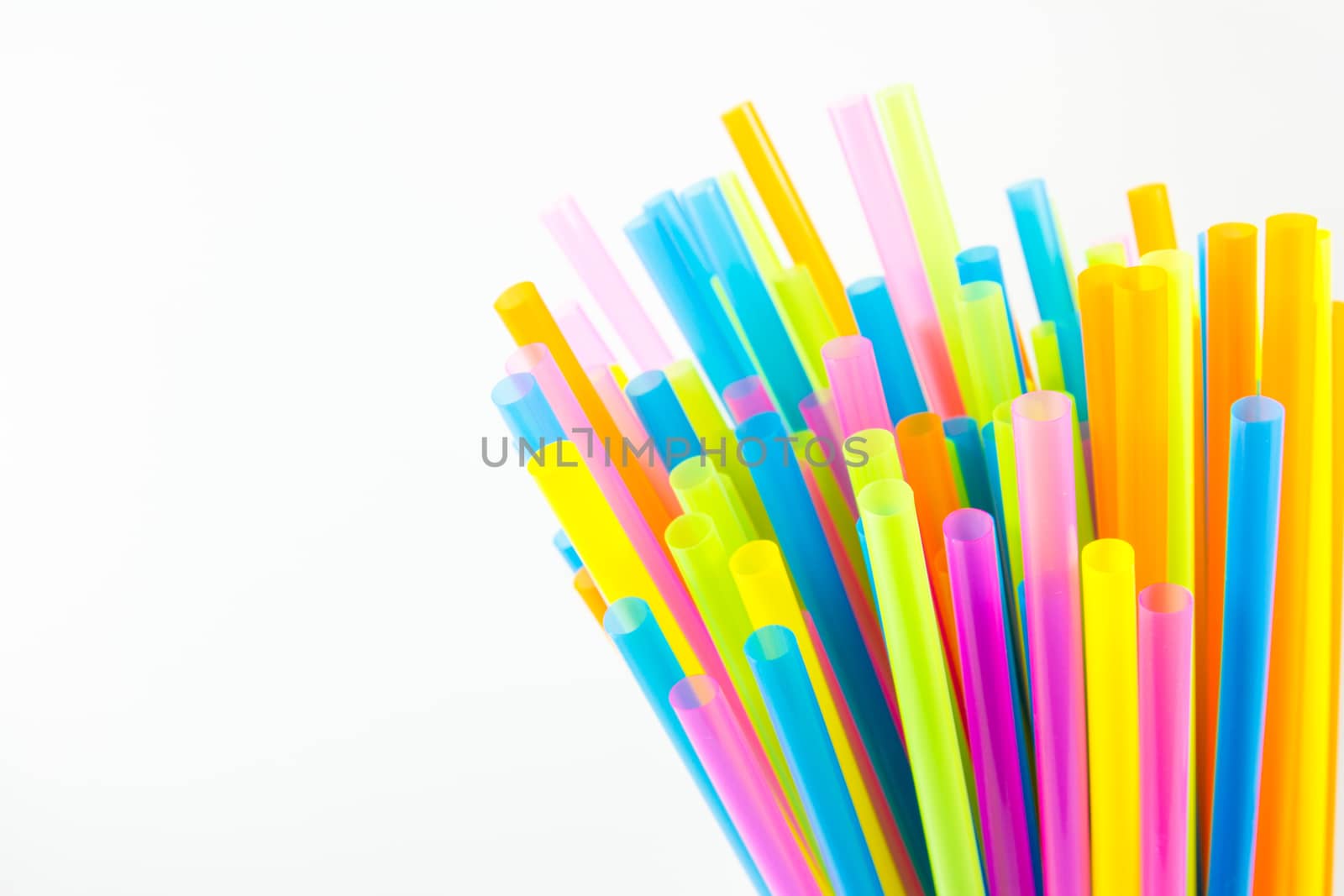 Colorful drinking straws isolated on white background by kasinv