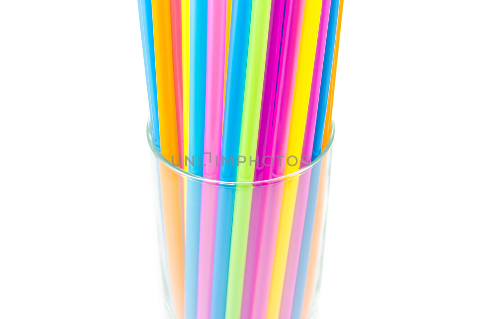 Drinking straws in glass isolated on white background by kasinv