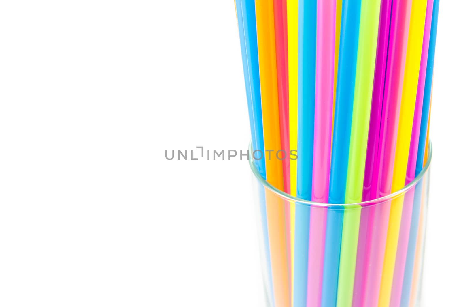 Drinking straws in glass isolated on white background by kasinv