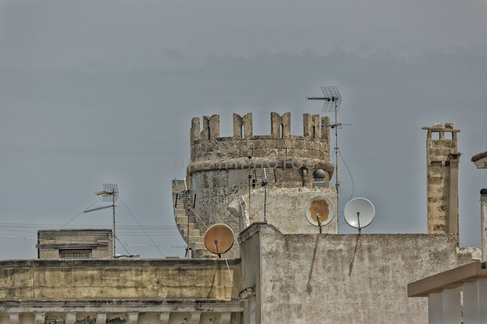 Tower and satellite dishes in the old town of Gallipoli (Le) in the southern of Italy