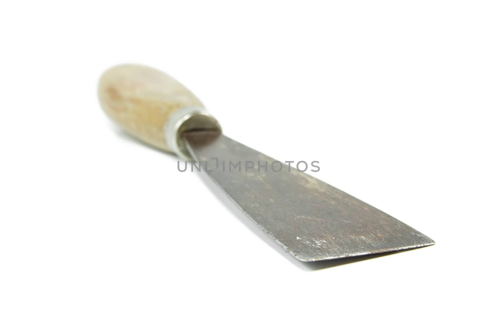 Trowel with wooden handle isolated on white background, shallow depth of field