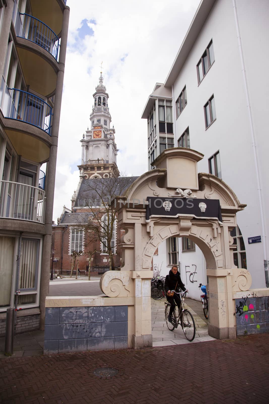 old church tower of Zuiderkerk with porch and bicycle in Amsterdam