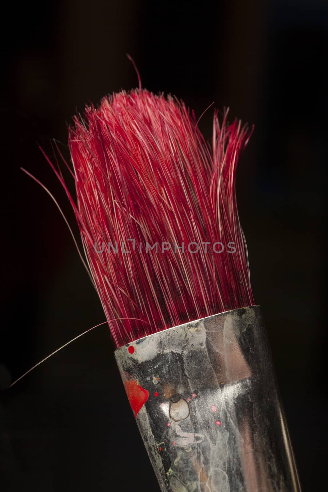 part of paintbrush used for red paint