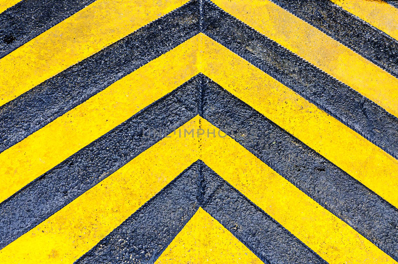 Yellow directional arrows on street