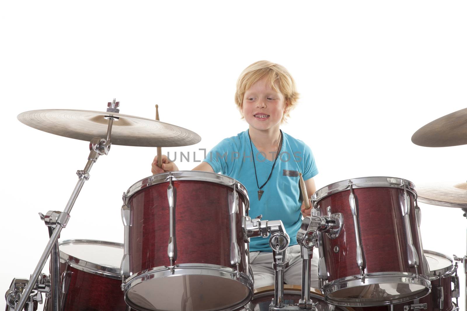 young boy playing drums by ahavelaar