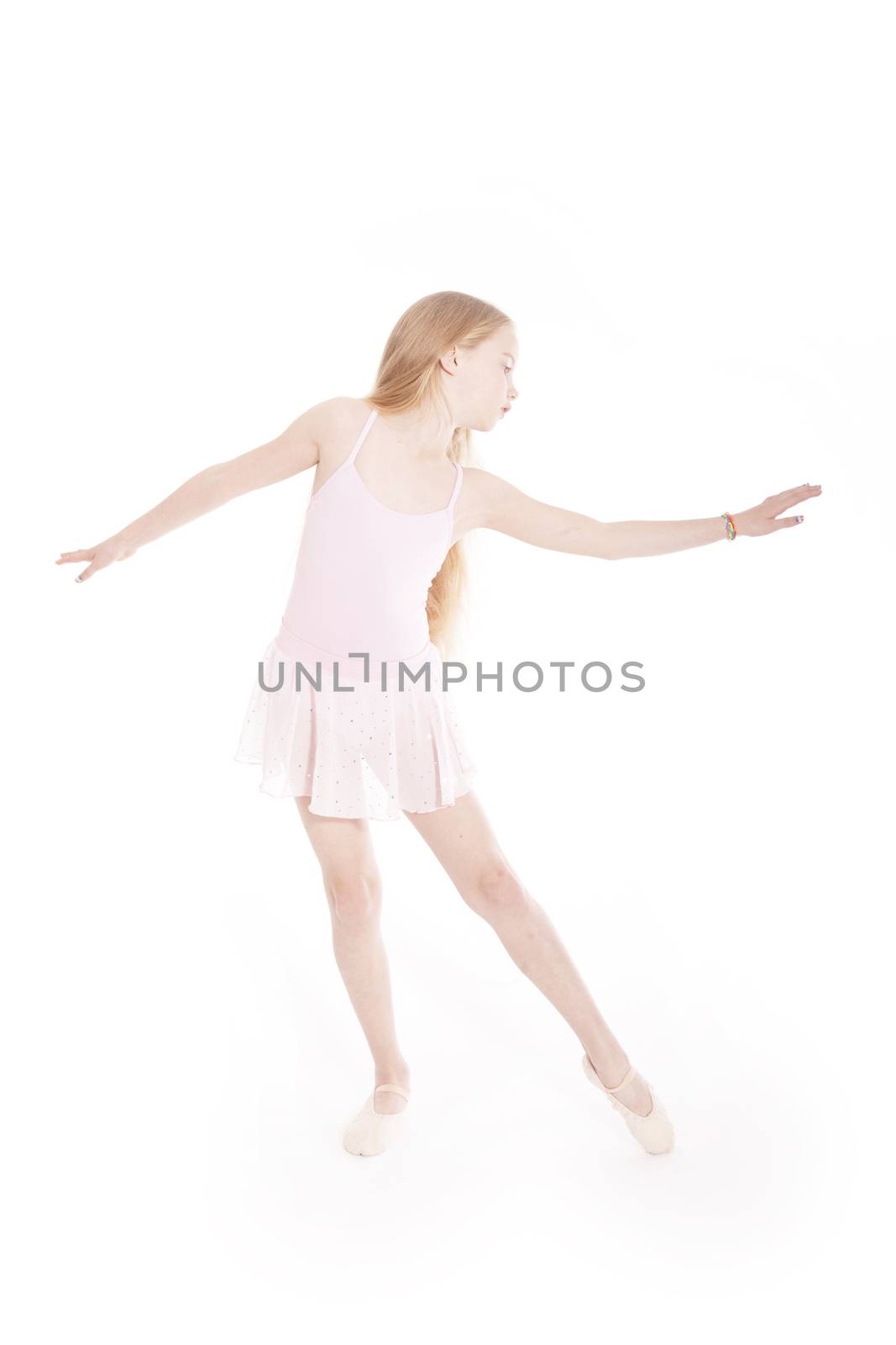 girl dancing in pink ballet suit in studio by ahavelaar