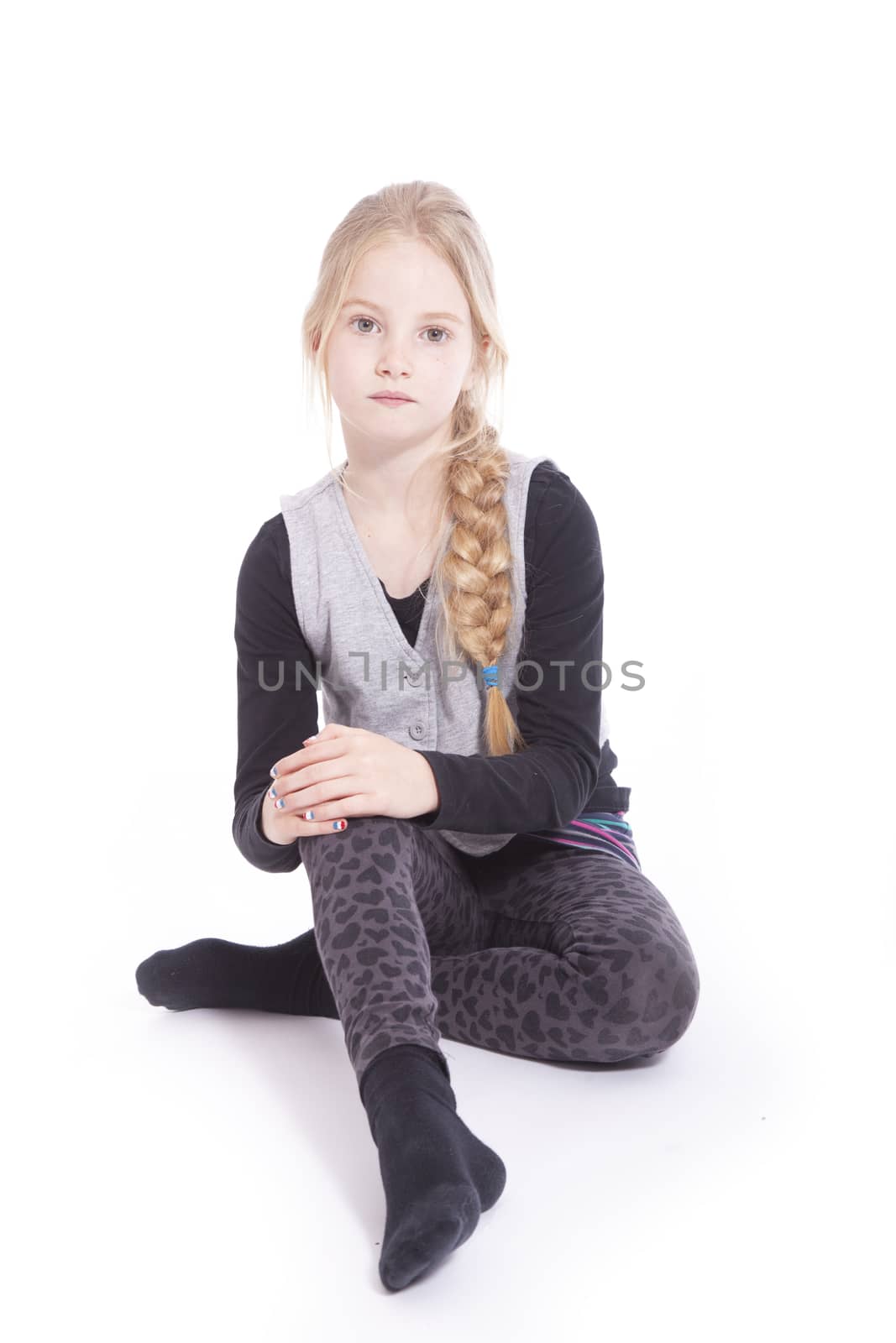 portrait young girl sitting on floor of studio by ahavelaar