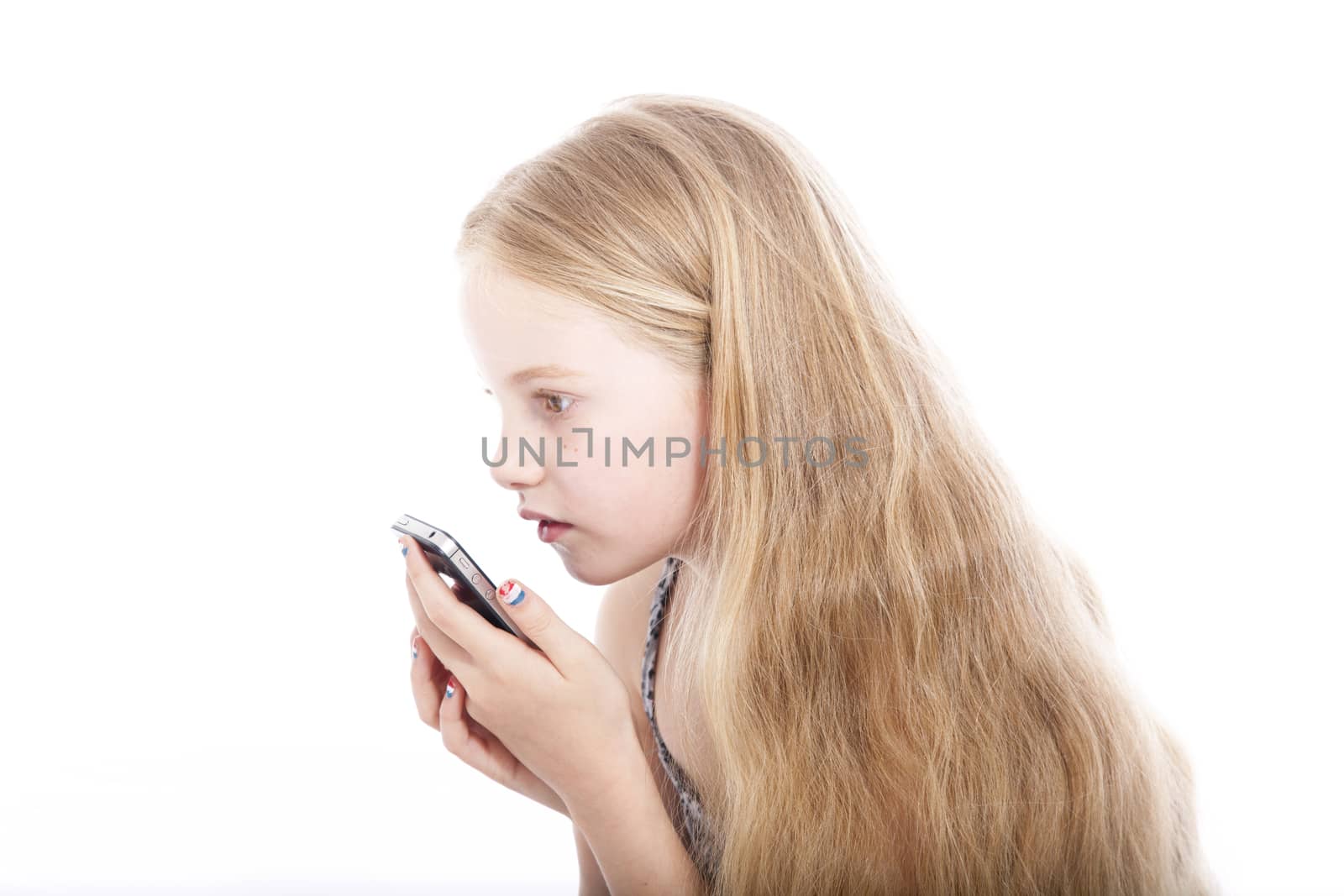 young blond girl with mobile phone in studio by ahavelaar