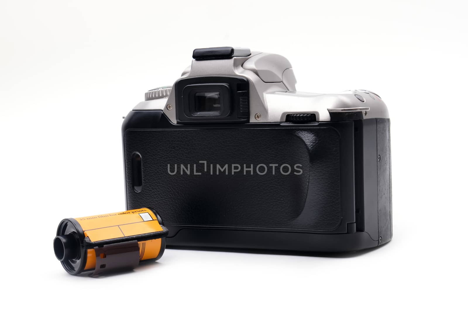 camera with 35 mm film on white background