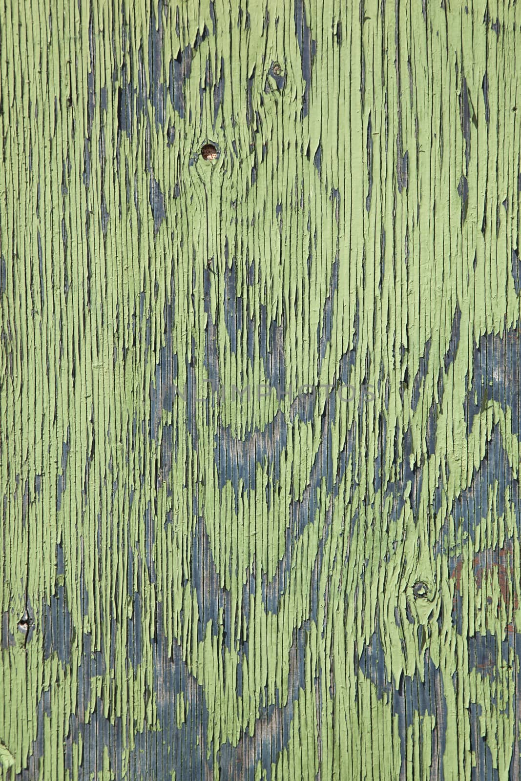 board with peeling green and blue paint by ahavelaar