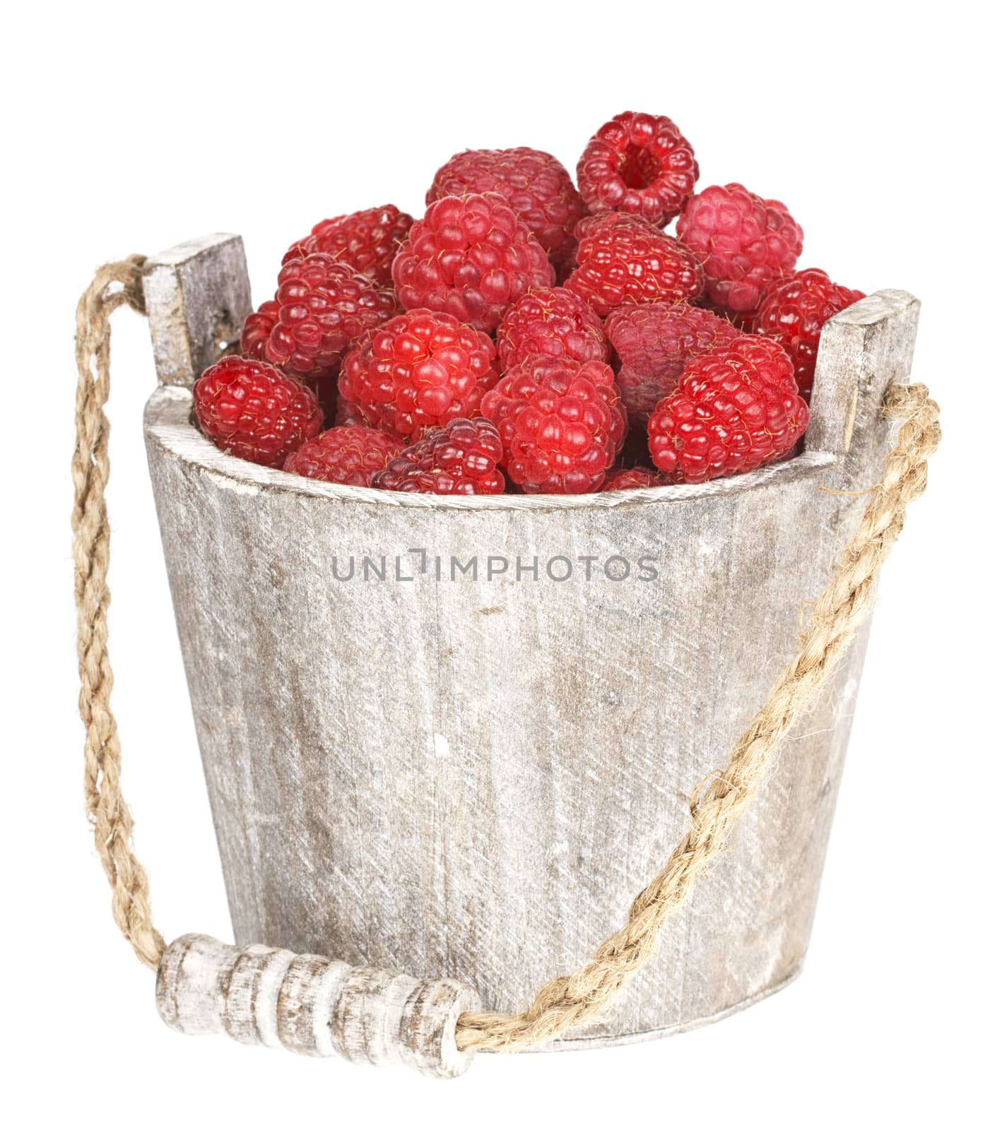 Fresh raspberry in the wooden bucket by Bedolaga