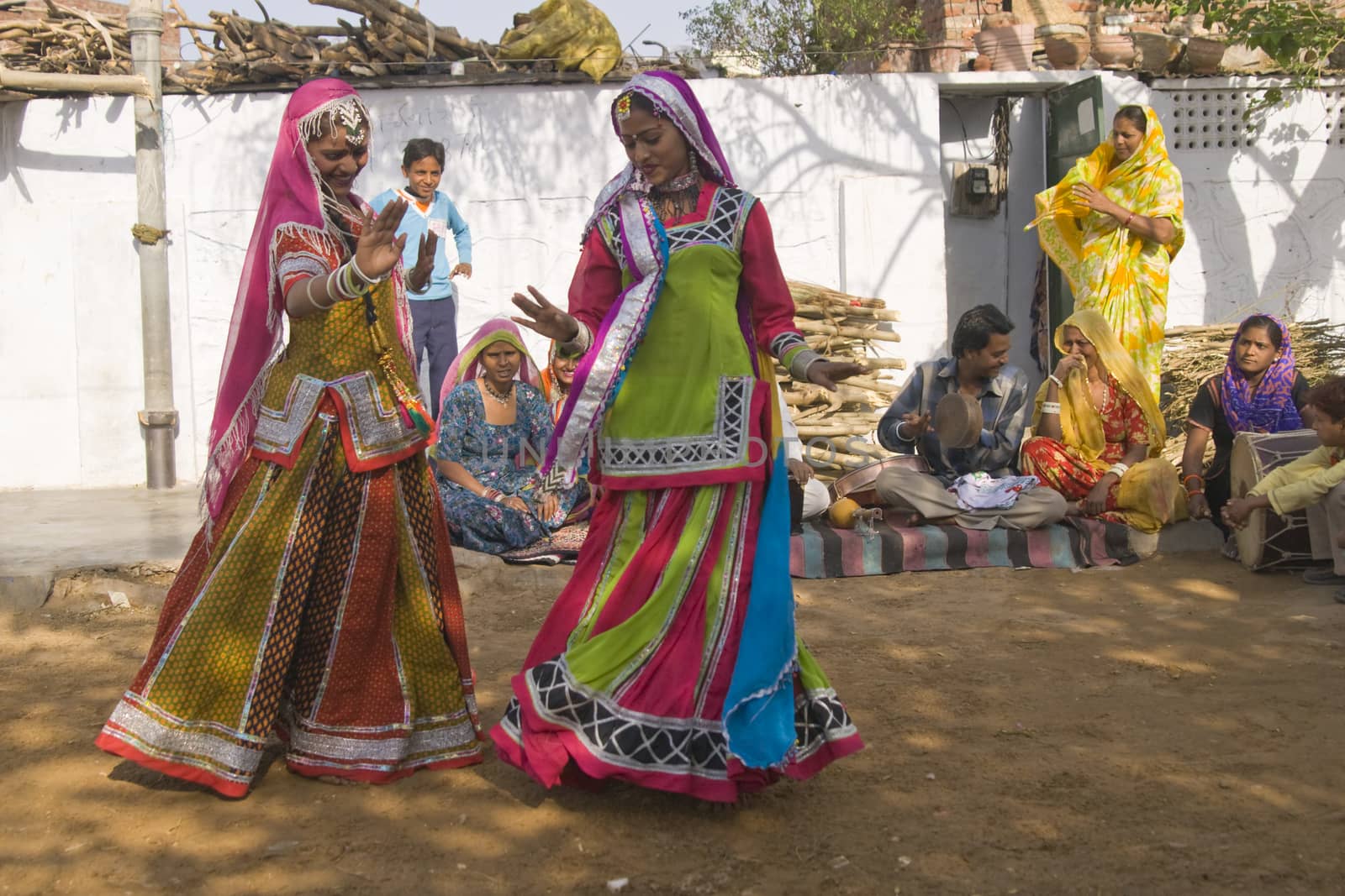 Beautiful tribal dancers in colorful costume performing in Jaipur, Rajasthan, India