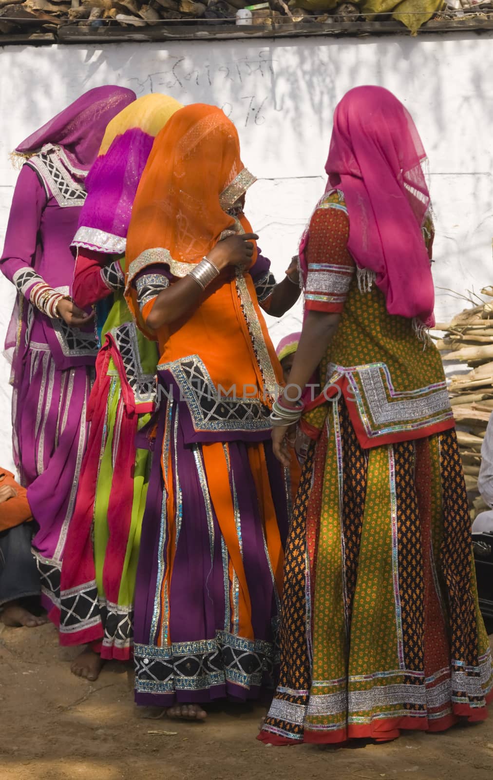 Veiled tribal dancers in colorful costume performing in Jaipur, Rajasthan, India