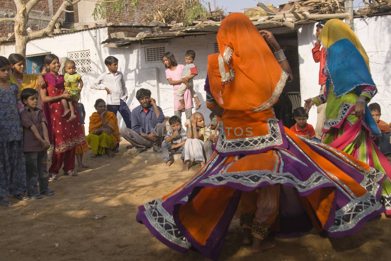 Beautiful tribal dancers in colorful costume performing in Jaipur, Rajasthan, India