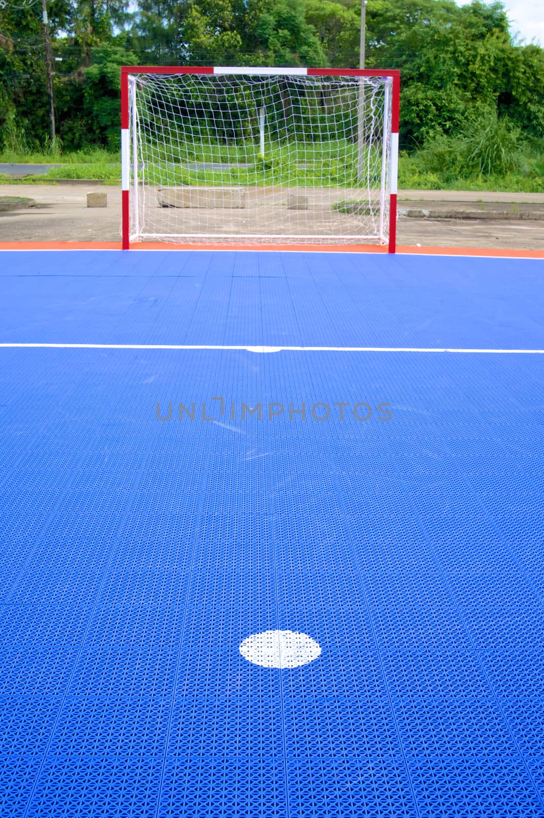 Point of penalty in front of blue soccer field by eaglesky