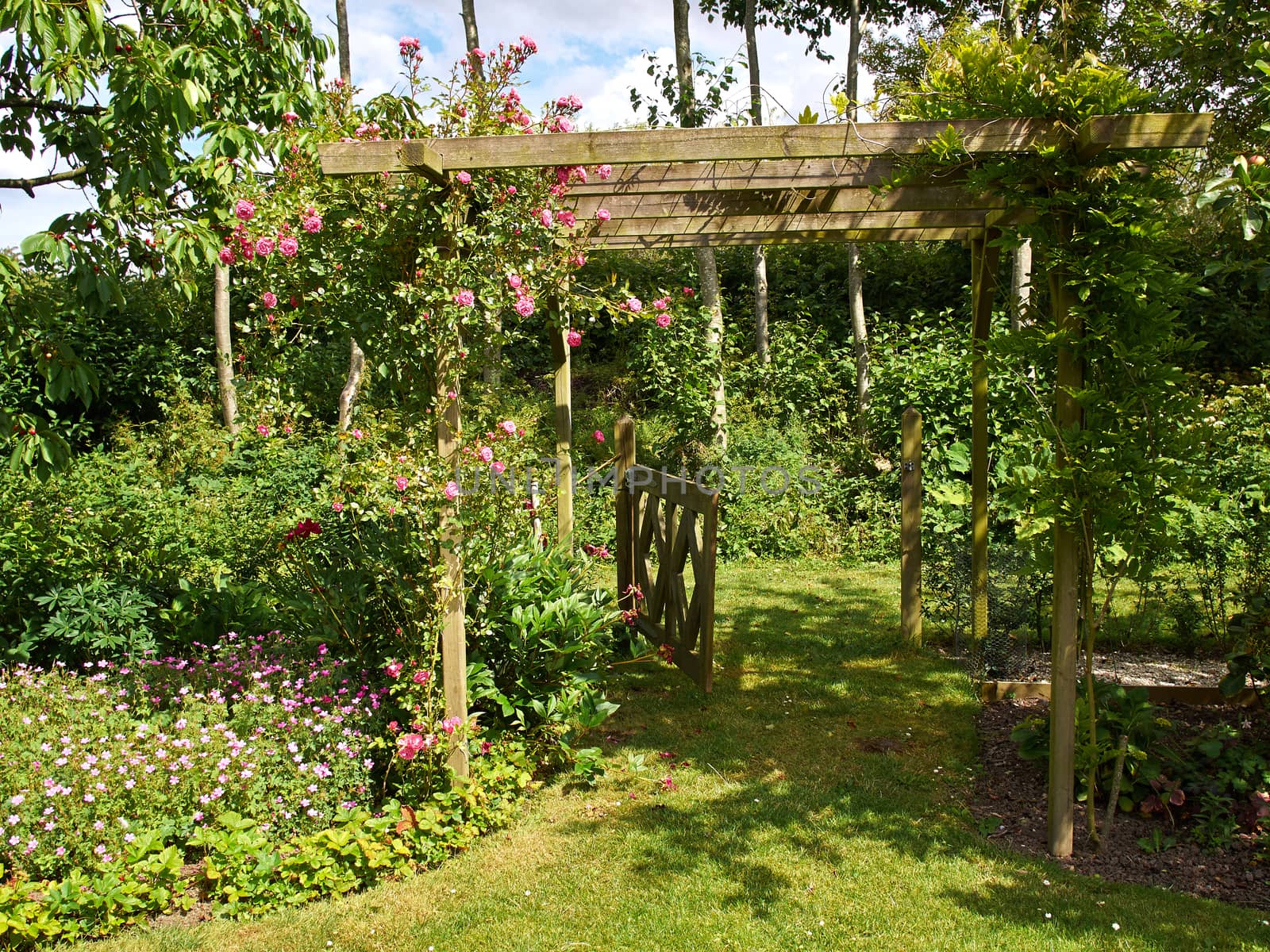 Beautiful gardening project - creative garden tunnel archway in a classical garden