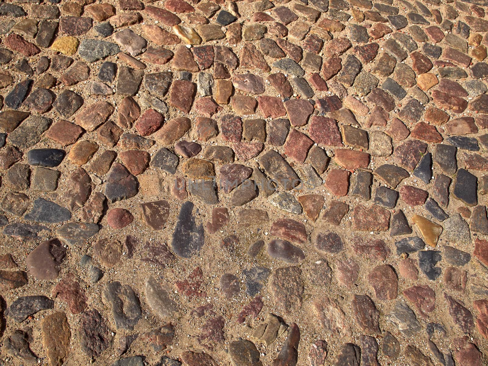 Old cobbled stones pattern road background