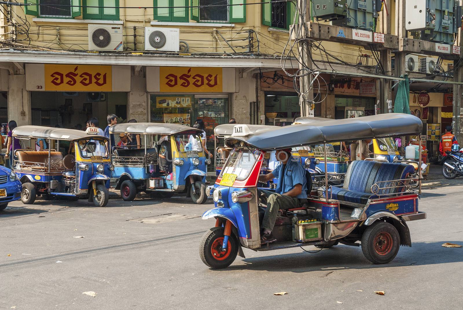 tuk tuk taxis in bangkok thailand by jackmalipan