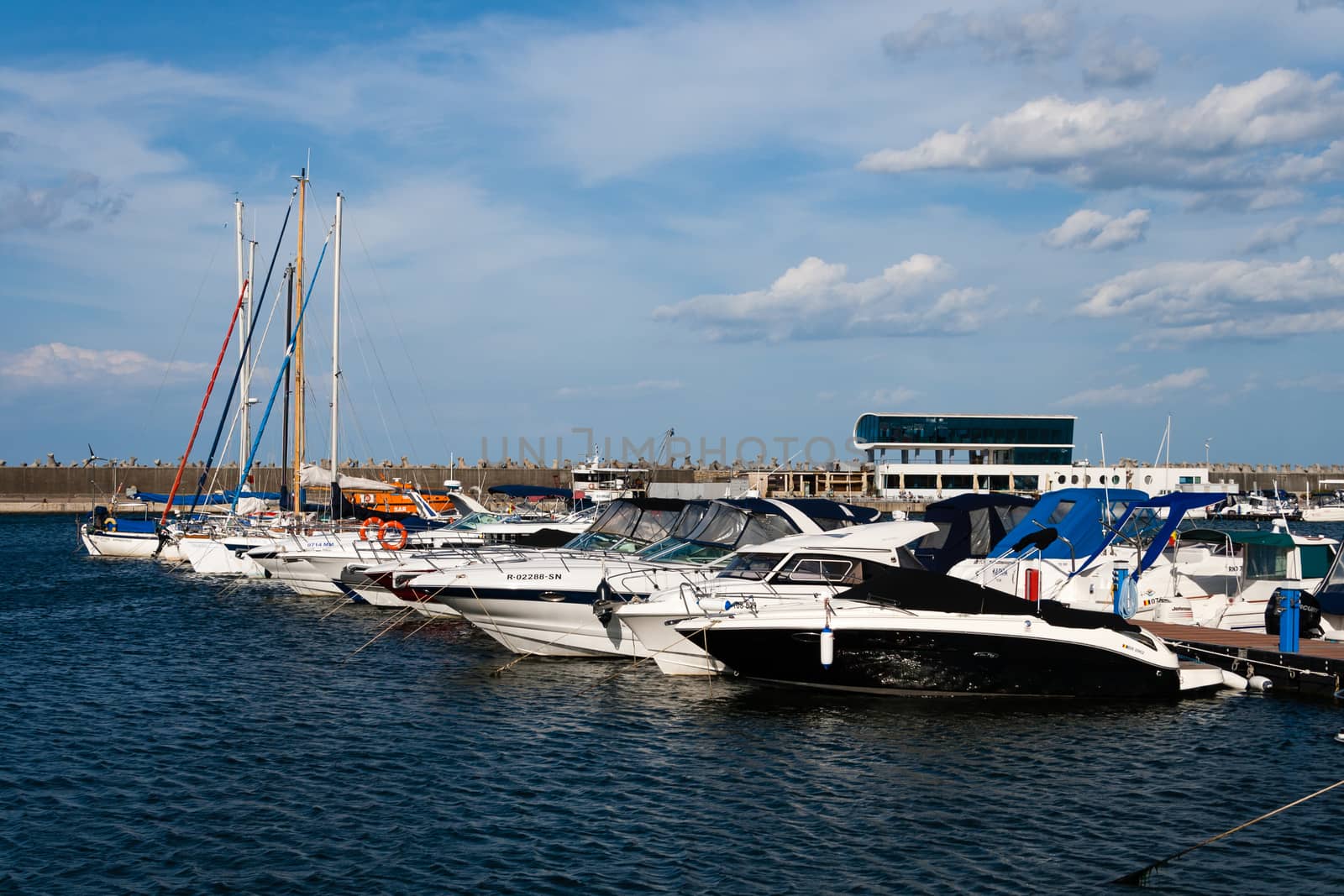 yachts and boats anchored in sea port