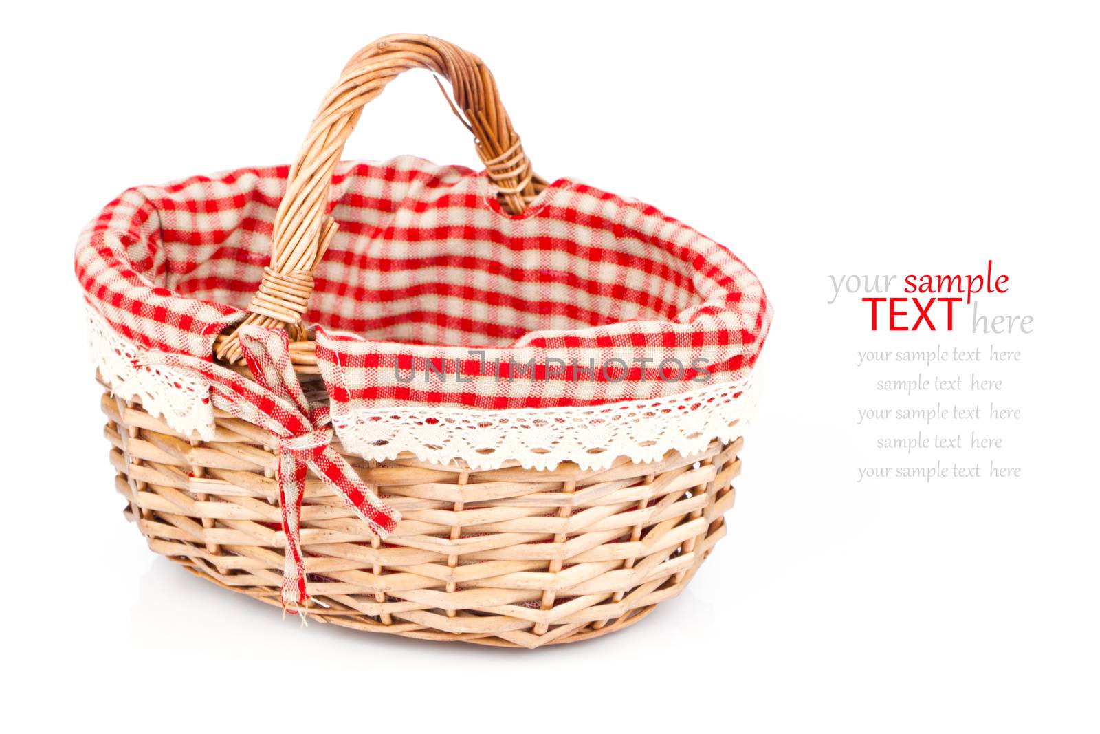 Empty wicker basket with red linen lining, isolated on white background