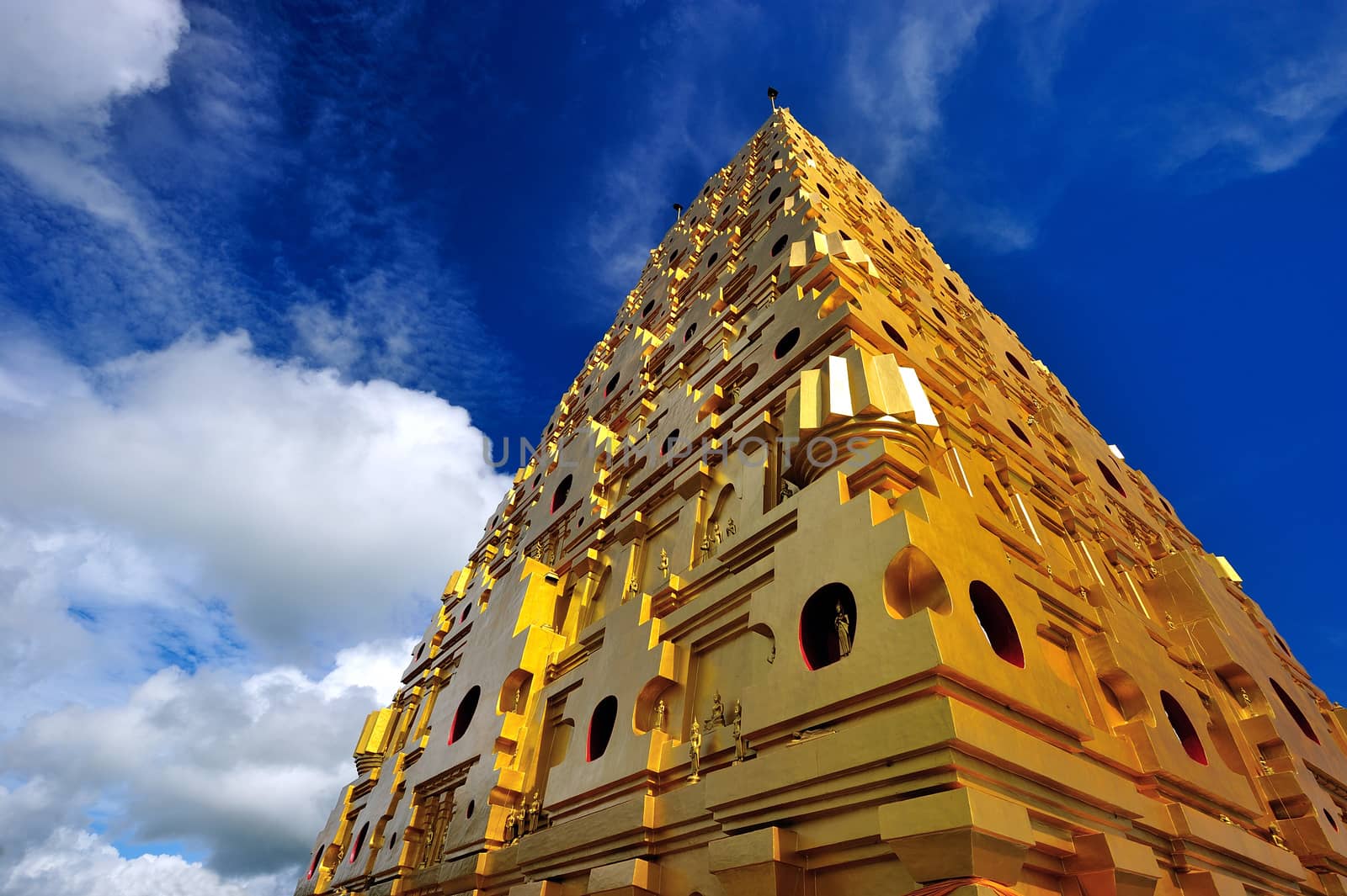 Golden Pagoda in the province of Kanchanaburi, Thailand by think4photop