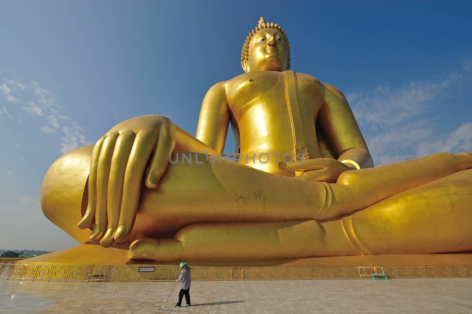 Golden Buddha statue at Wat Muang in Angthong, Thailand by think4photop