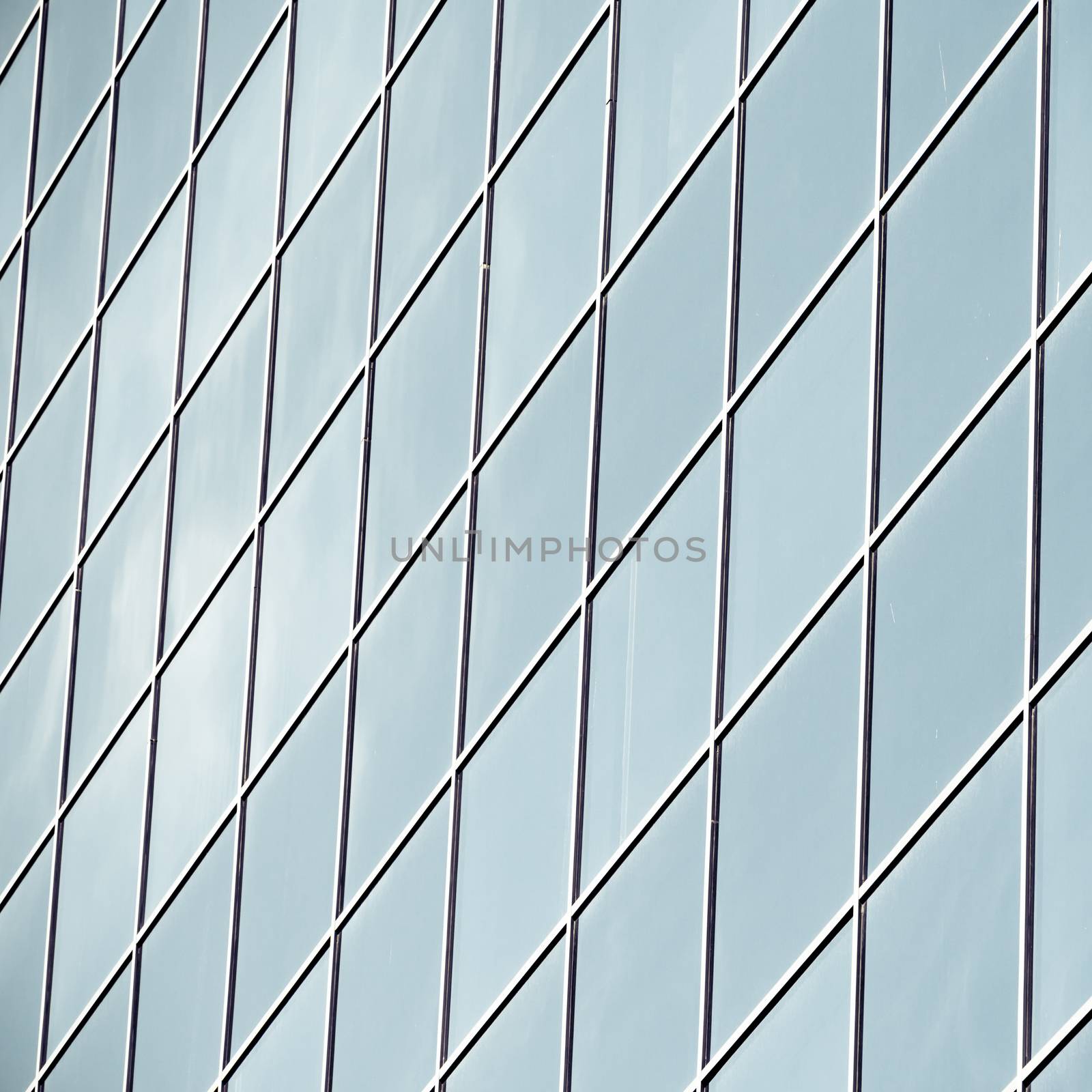 perfect texture of blue glass high-rise corporate buildings and industrial skyscrapers in business office center