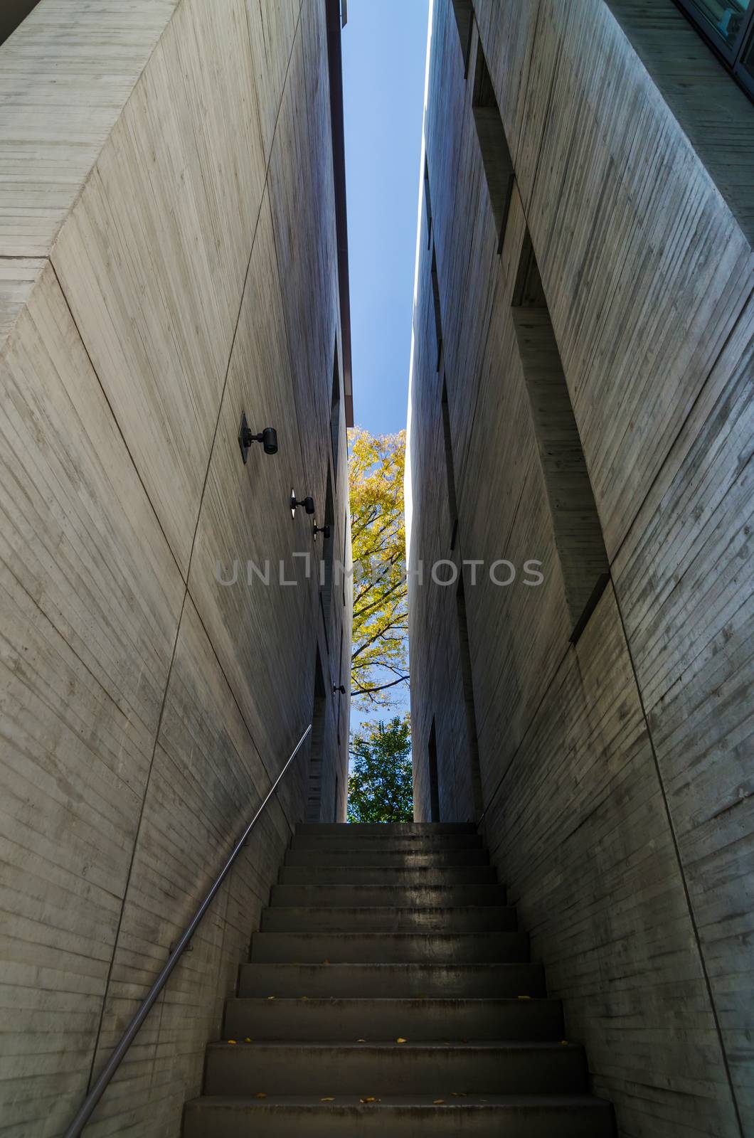 Grey stair between a stone wall