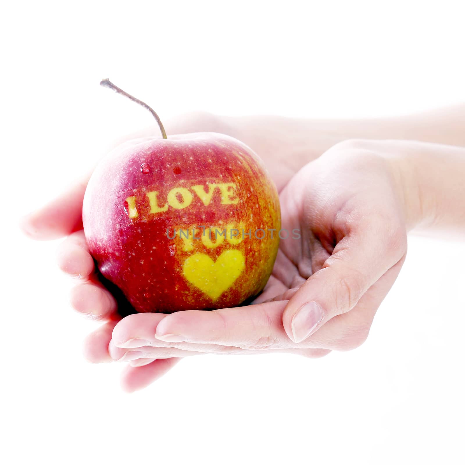 Gift, valentine. Man with delicious apple on a white background