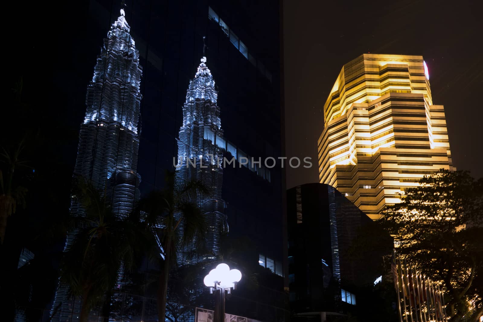 Reflection.Street near Petronas Twin Towers in Kuala Lumpur. EDITORIAL
Kuala Lumpur, Malaysia, June 17 2014.