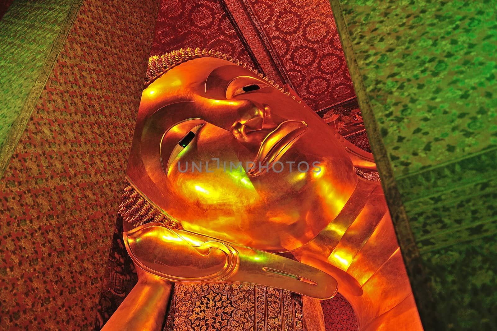 The face of Reclining Buddha statue in Thailand Buddha Temple Wat PO
