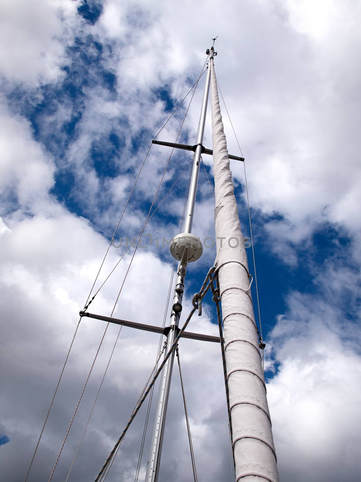 Sails and mast with radar of a modern sail boat boating sailing background 