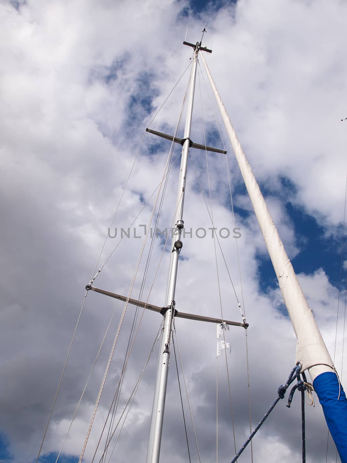 Sails and mast with radar of a modern sail boat boating sailing background