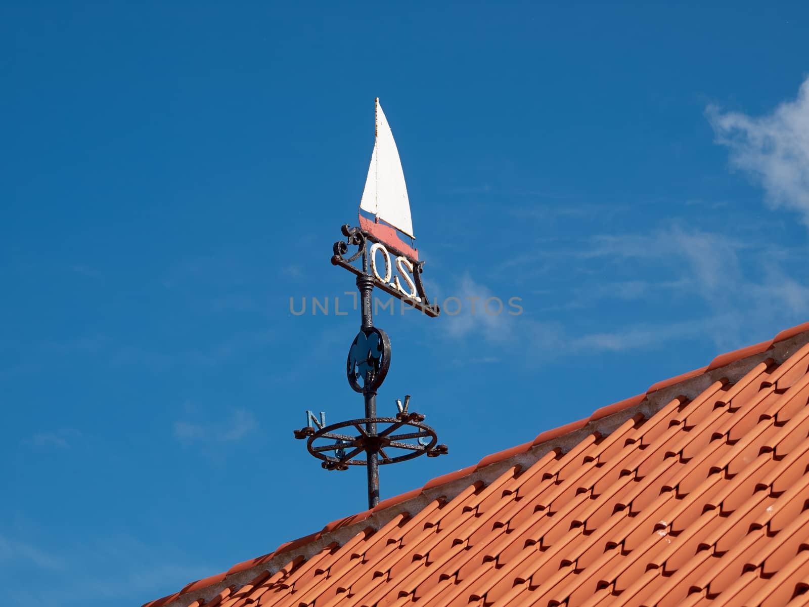 Traditional marine weather vane in a marina port