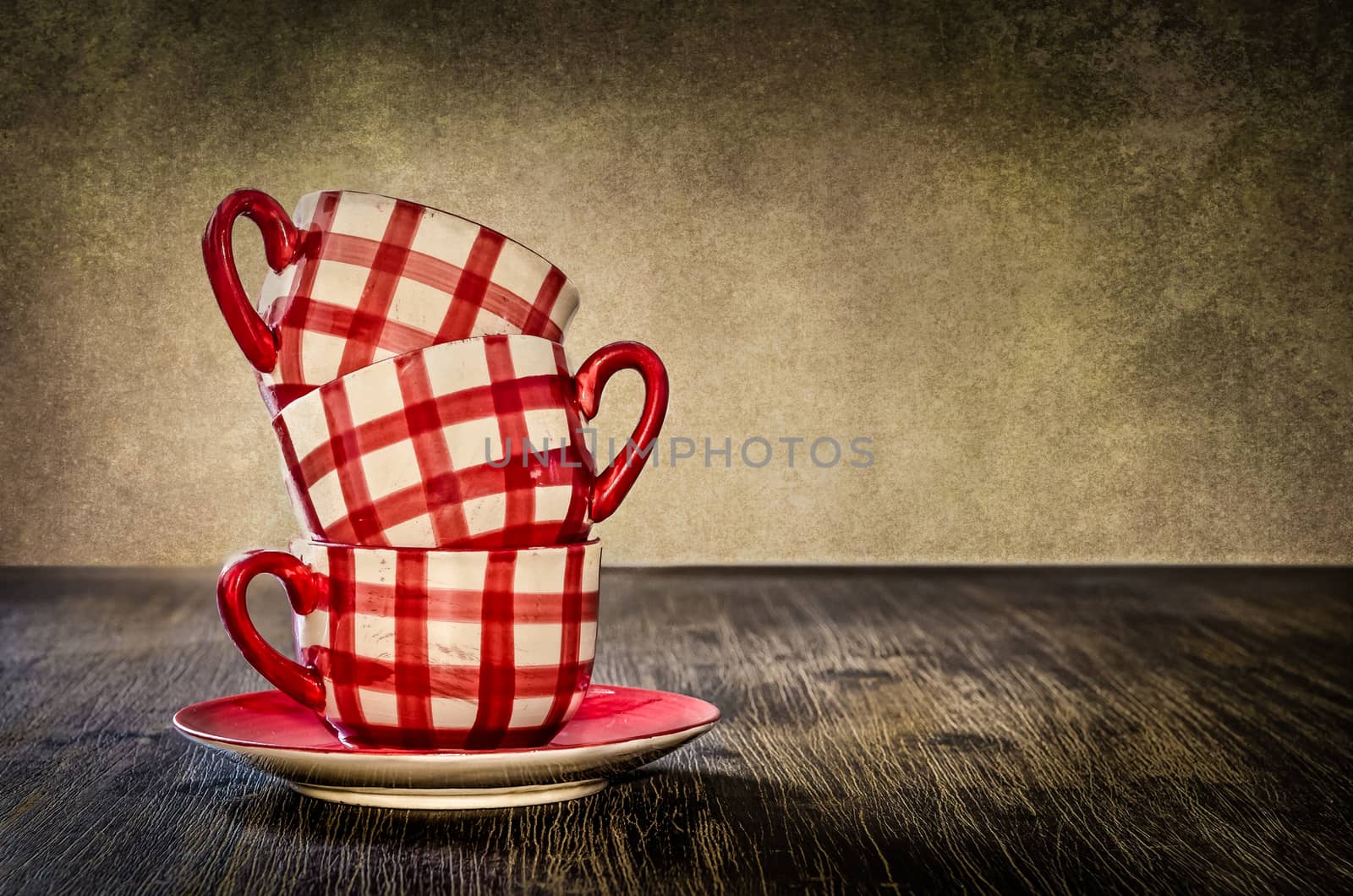 Detail of colorful coffee cups on the table in vintage style
