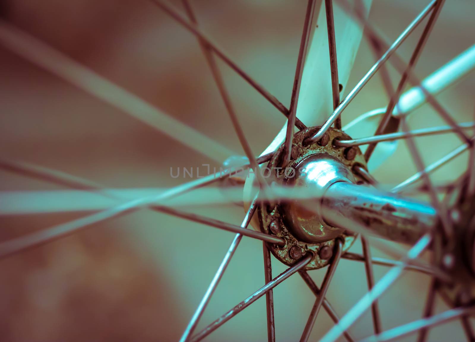 Grunge style retro artistic close-up on a bicycle front wheel by Lizard