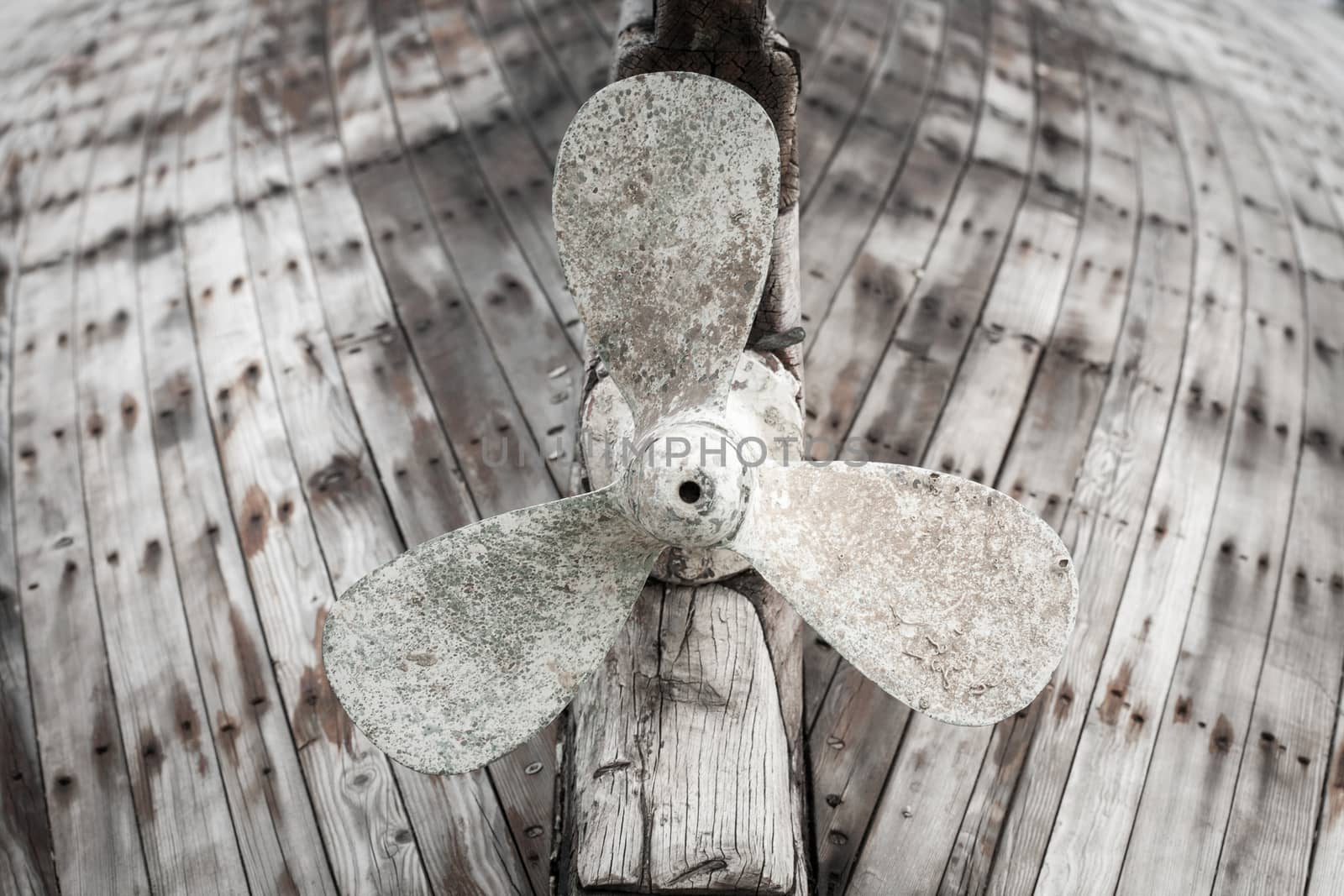 Old wooden fishing boat propeller,artistic toned photo